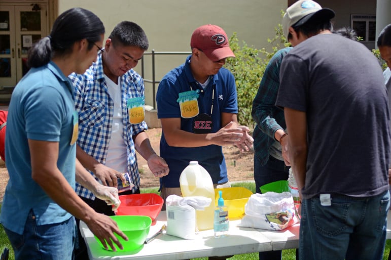 A group of student contestants gathered last week around a table at the University of New Mexico to make fry bread -- one of the competitions involved in winning the title of "the Mutton King." This mock-male pageant connected current and former students in a playful event full of dancing and laughter.